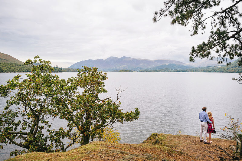 panoramic view of couple standing overlooking the water