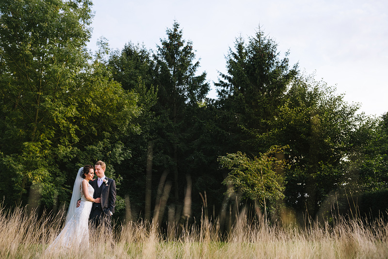 Great fosters Wedding Portrait in the long grass