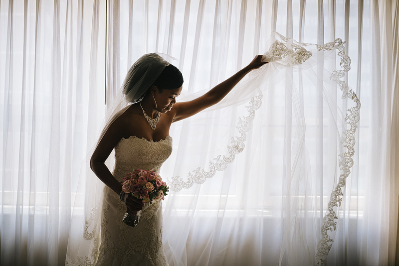 bride fanning out her veil 