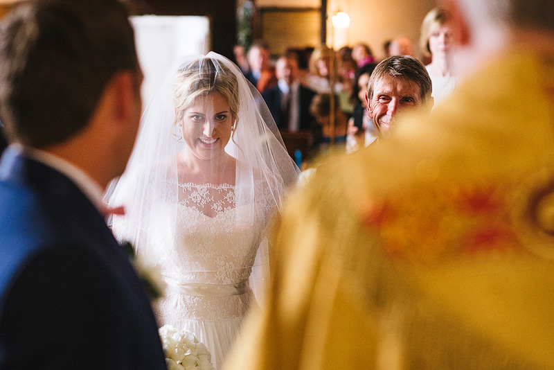 bride walks down aisle in hampshire village wedding