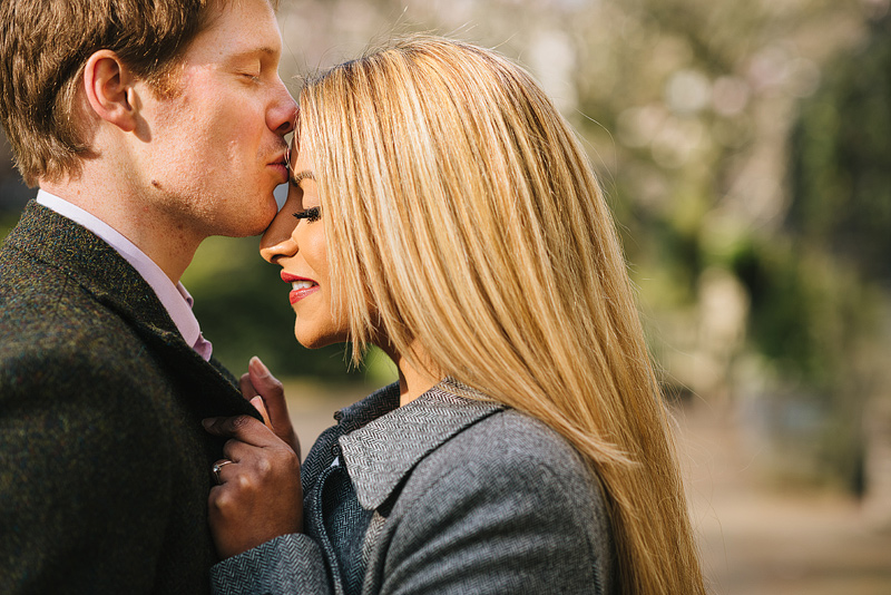 boyfriend tenderly kisses his girlfriend on the forehead