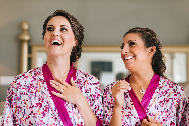 bridesmaids gush over the necklances they've been given as gifts