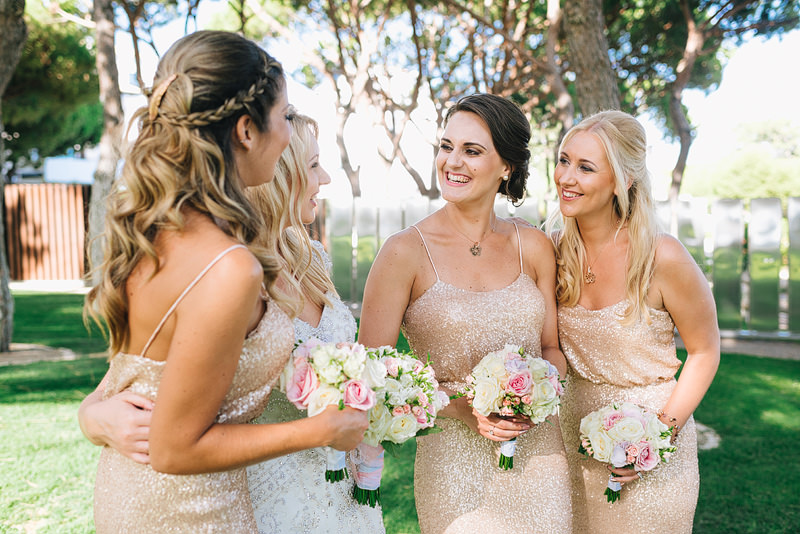 Pretty bridesmaids in sequined dresses giggling among themselves