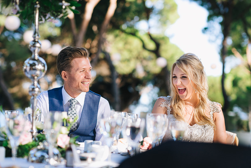newlyweds laughing at speech