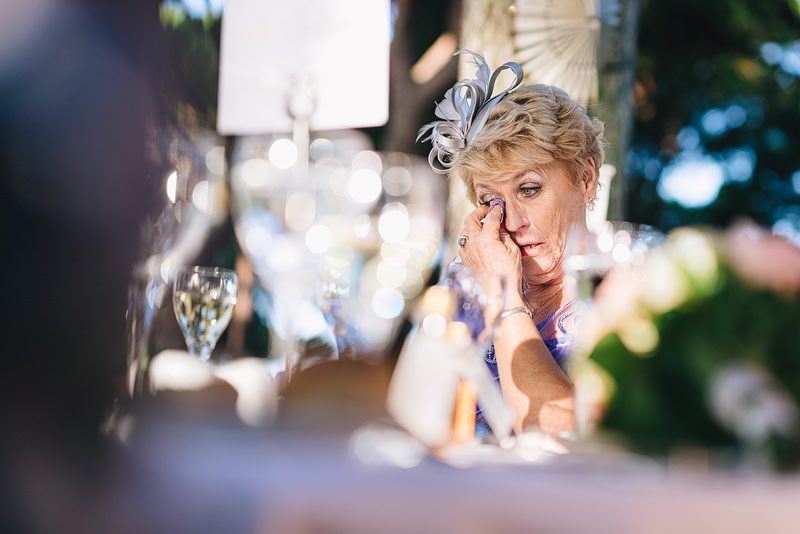mother of the groom cries at his thoughtful words