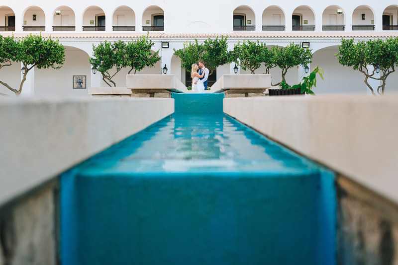 portugese style architecture surrounds the just married couple
