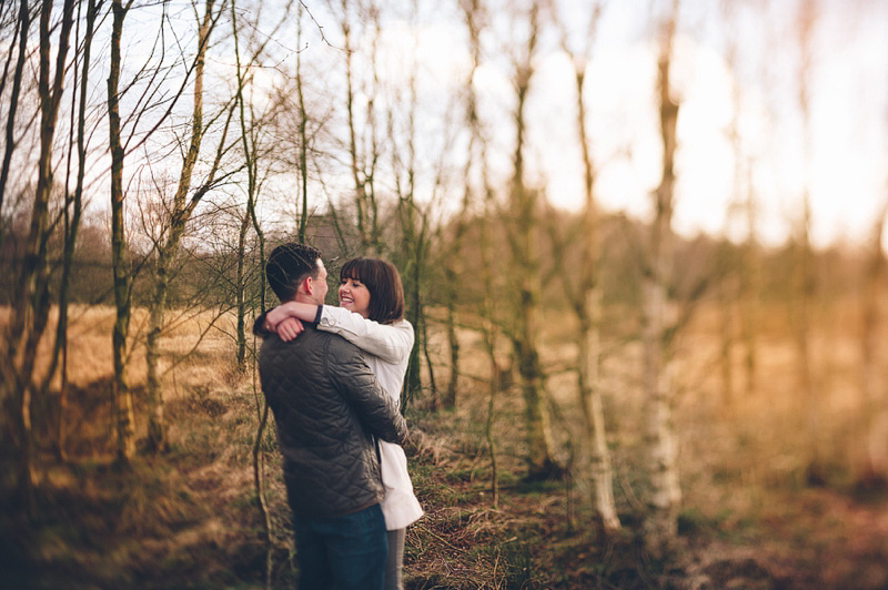 Engagement photos of couple laughing