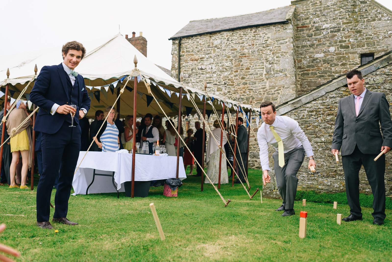 Guests playing lawn games at Roscarrock Farm Wedding Photos Cornwall