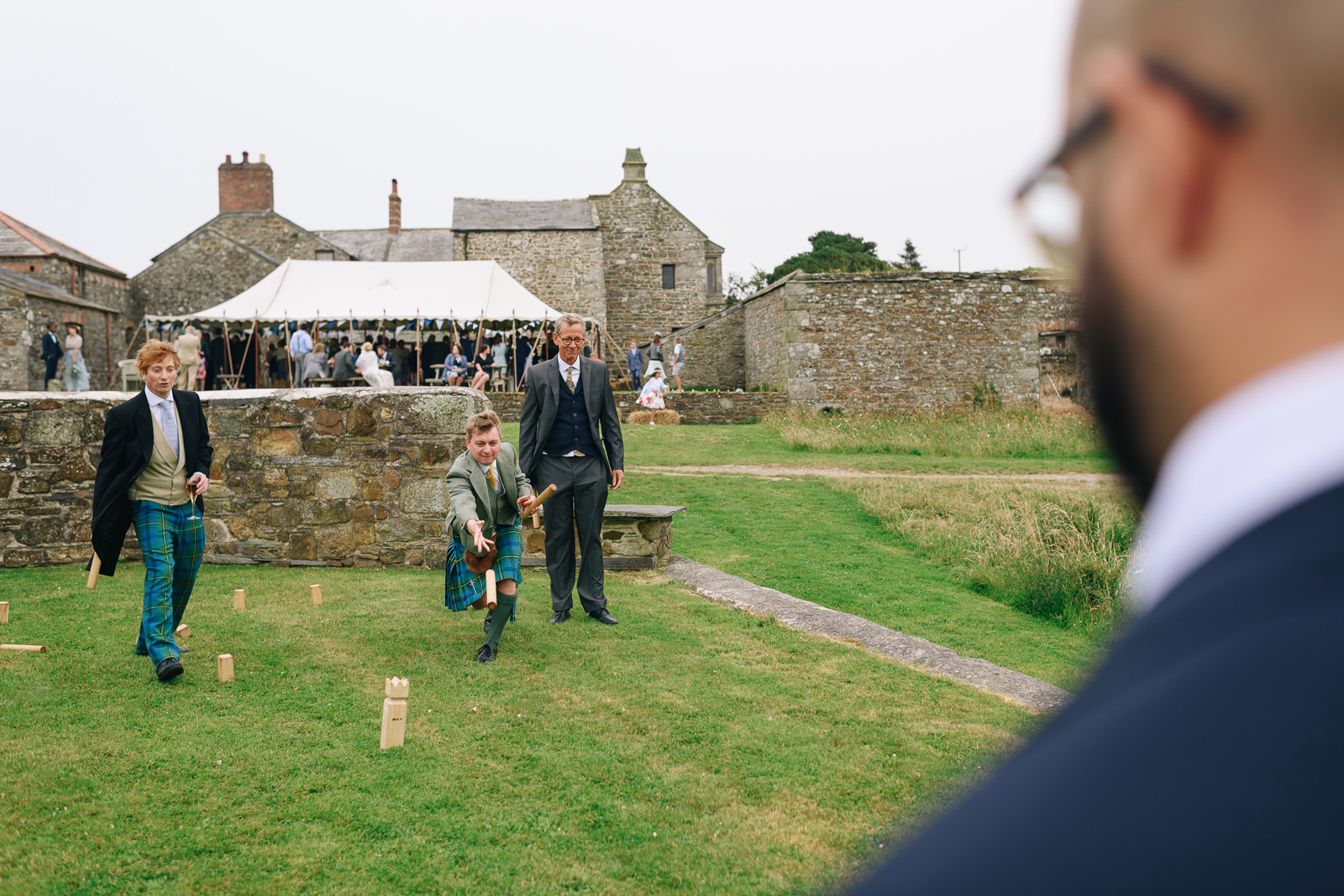 Guests playing lawn games at Roscarrock Farm Wedding Photos Cornwall