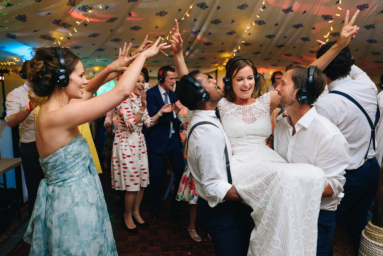 Bride celebrating with friends during silent disco at Roscarrock Farm Wedding in Cornwall
