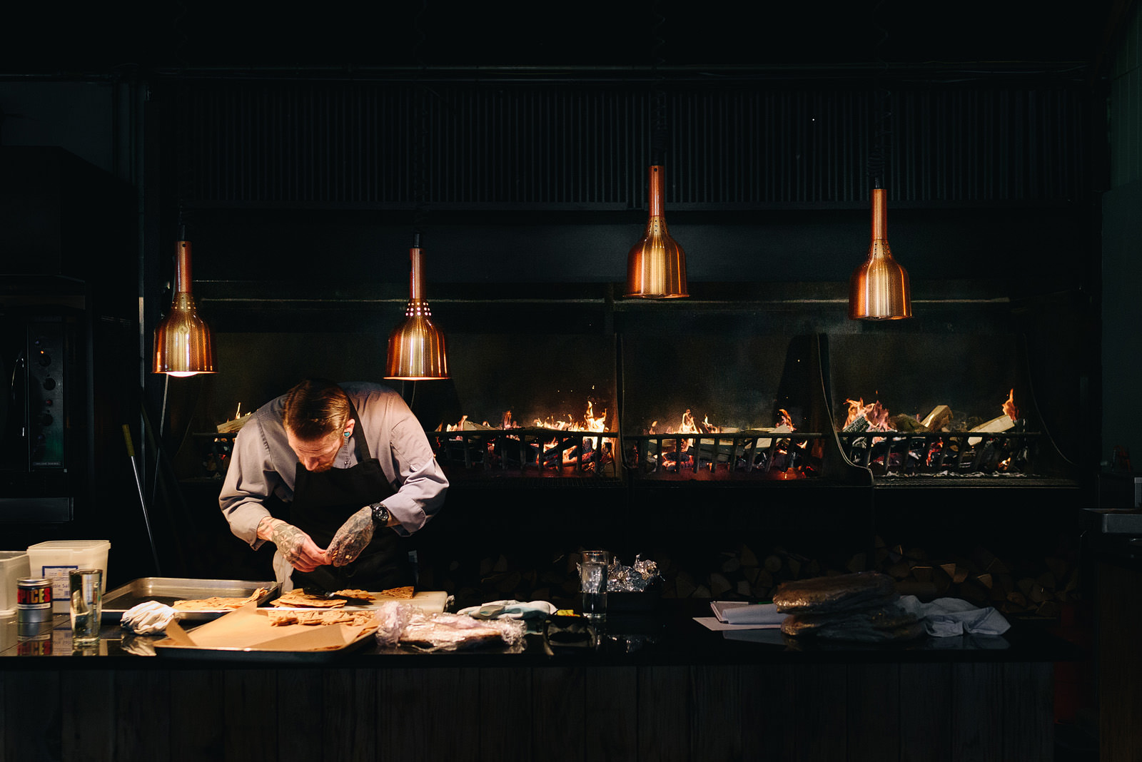 Chef preparing food on the barbecue at Cripps Stone Barn.