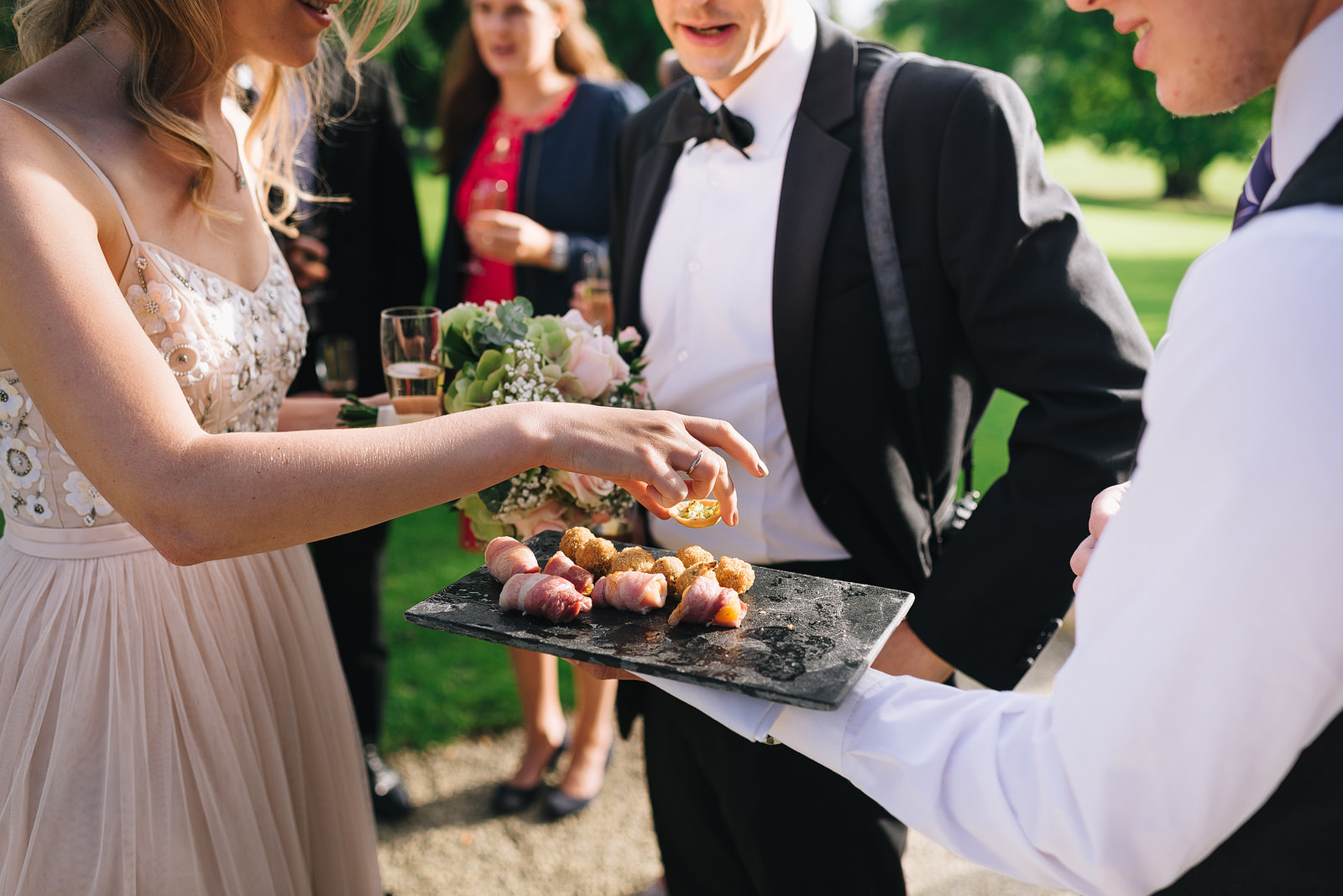 a guest takes a canape