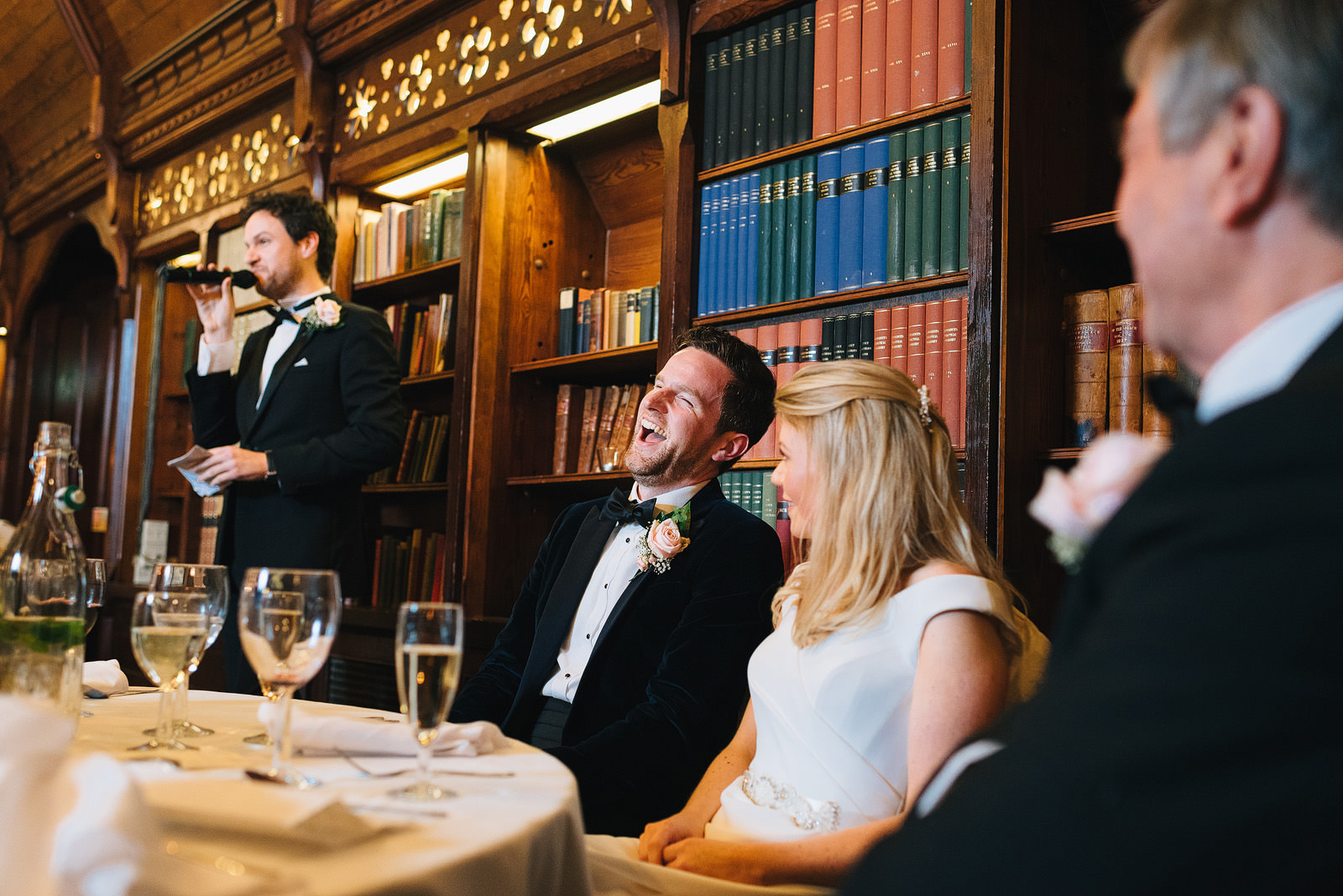 groom laughs during the best mans speech
