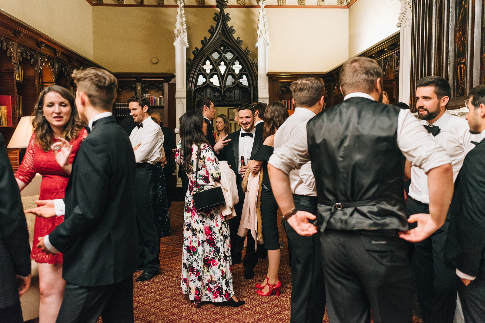 guests mingle in the library