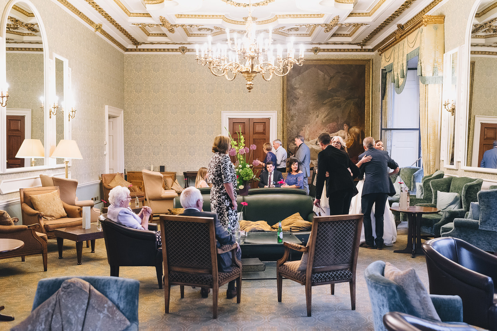 Guests mingle in the great hall 