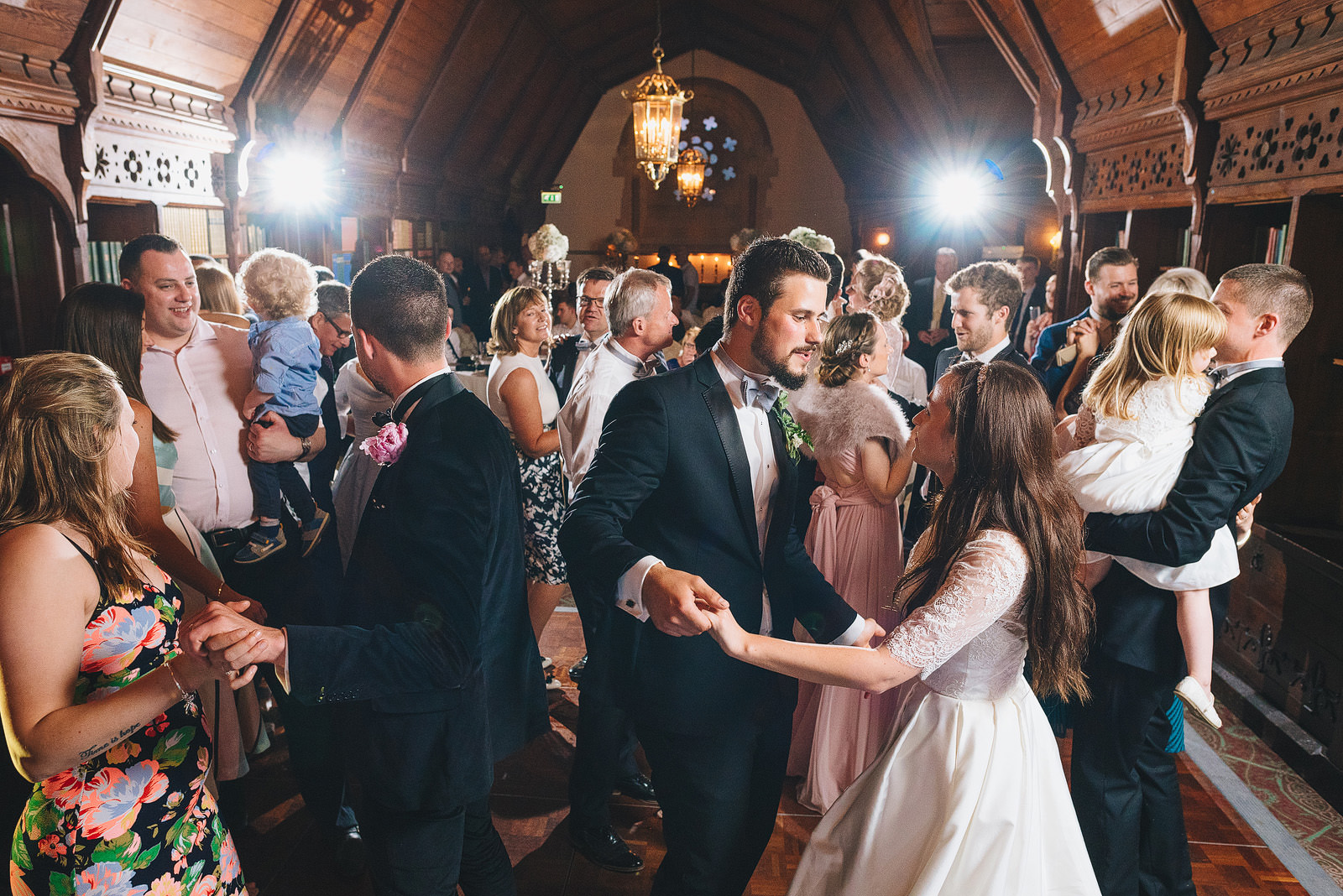 Wedding guests dancing in the long room