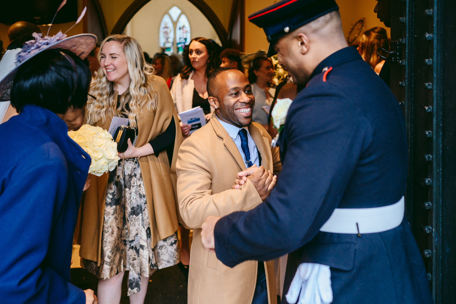 The couple receive congratulations from guests